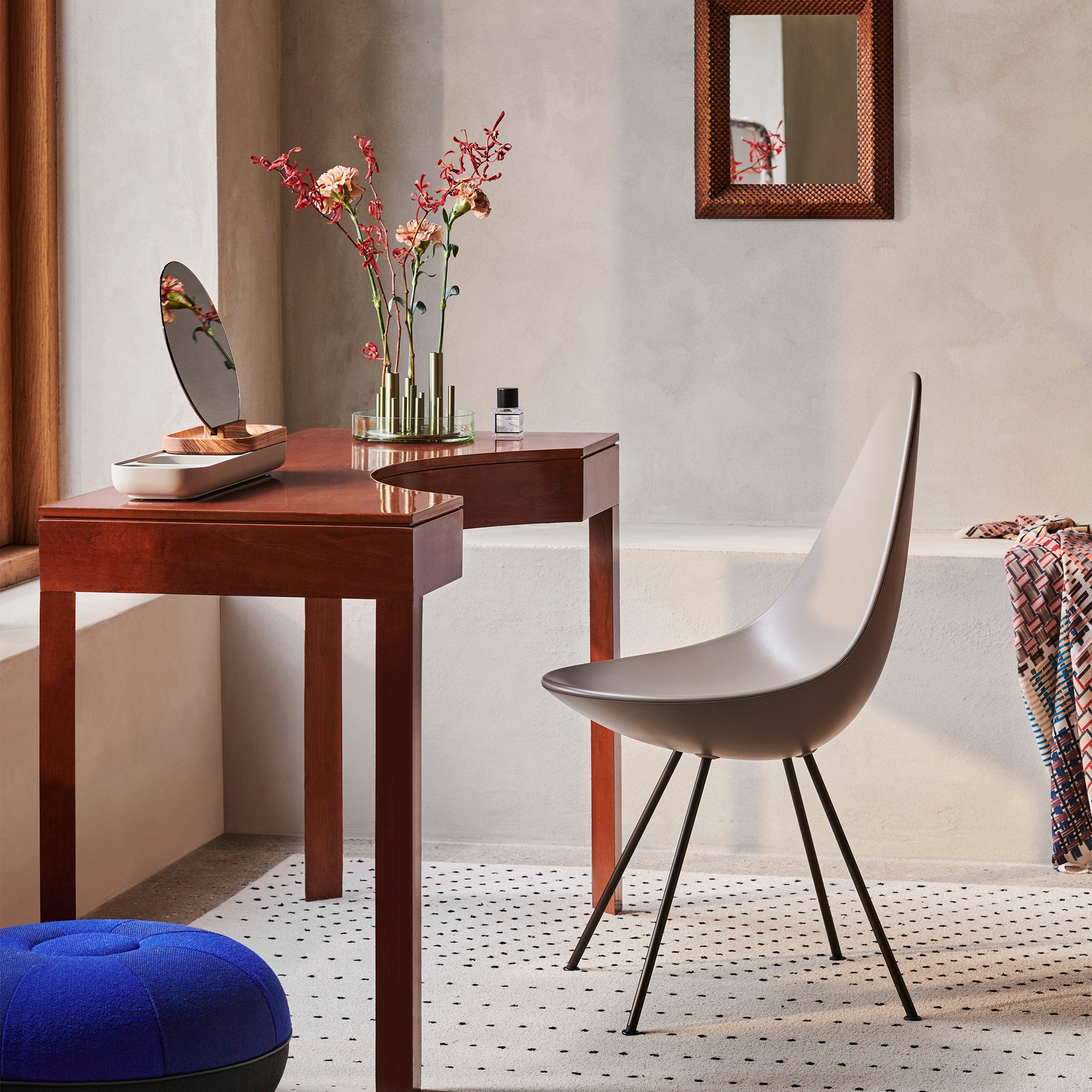 Fritz Hansen 3110 Drop Chair in Deep Clay — lifestyle, with Slide storage pouf