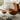 Fritz Hansen 3127 Egg Footstool in Walnut leather — lifestyle, living room with Egg Lounge Chair