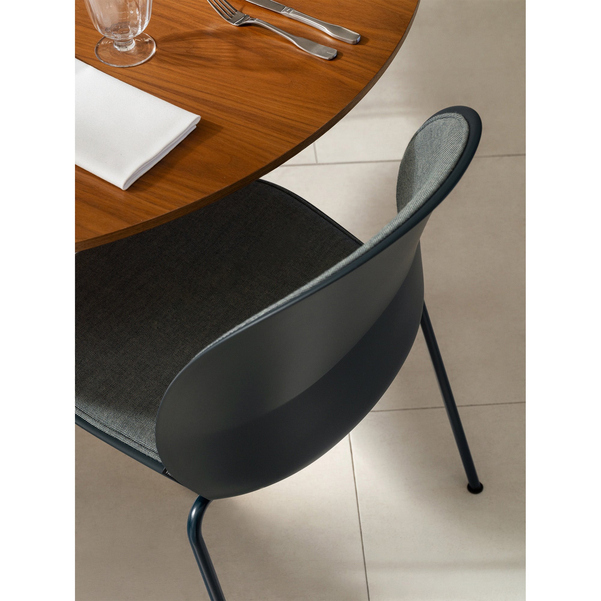 Fritz Hansen N02-10 Recycle Dining Chair Front Upholstered in Dark Blue — lifestyle, rear with Circular A825 table