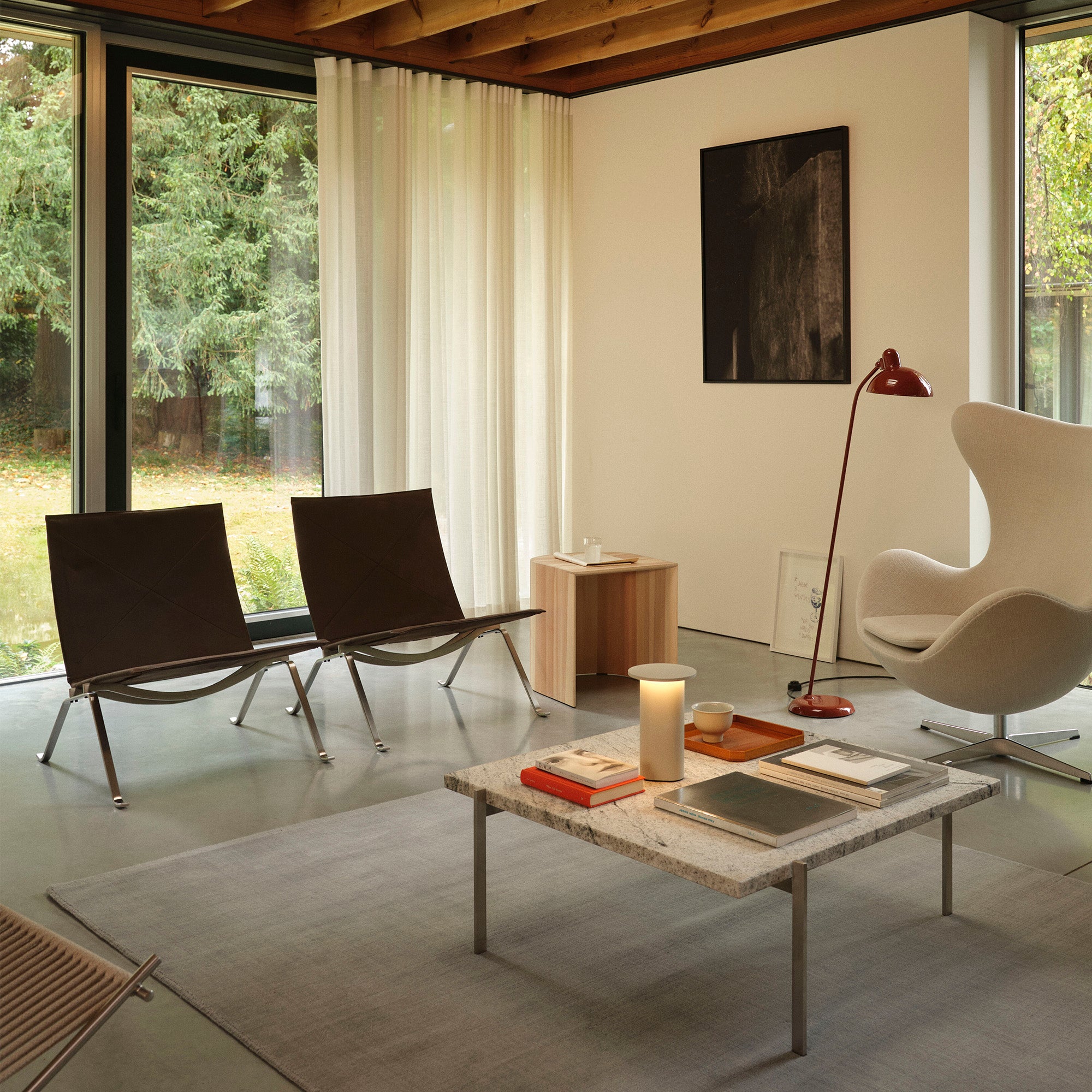 Fritz Hansen PK22 Lounge Chair in Haze Dark Brown — lifestyle, with PK61 Coffee Table, Egg Chair and Taburet