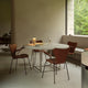 Fritz Hansen 3207 Series 7 Dining Armchair Upholstered in Chestnut leather — lifestyle, dining room with PK54 table