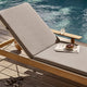 Skagerak Pelagus Sunbed in Sand — lifestyle, with Sunbed Cushion in Ash and armrest