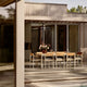 Skagerak Pelagus Outdoor Dining Armchair and Dining Chair with Extendable Dining Table in Light Ivory — lifestyle