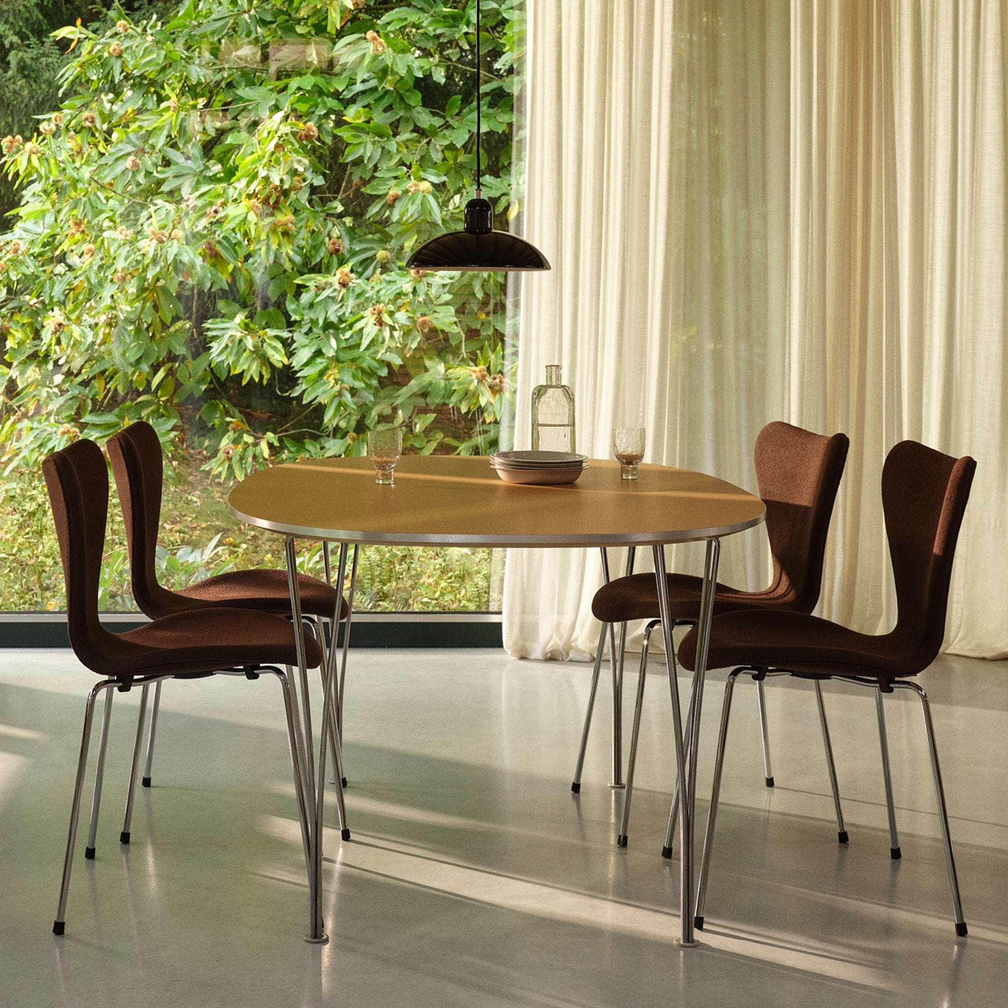 Fritz Hansen 3107 Series 7 Dining Chair Upholstered — lifestyle, with Superellipse Table and Kaiser idell Pendant Light