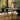 Fritz Hansen Superellipse Dining Table — lifestyle, dining room with black Series 7 chairs and Kaiser idell pendant