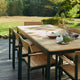Skagerak Pelagus Outdoor Dining Armchair and Dining Chair with Extendable Dining Table in Hunter Green — lifestyle