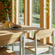 Skagerak Pelagus Outdoor Dining Armchair and Dining Chair with Extendable Dining Table in Light Ivory — lifestyle, detail
