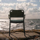 Fritz Hansen Vind Outdoor Dining Armchair in Hunter Green — lifestyle back view