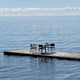 Fritz Hansen Vind Table with Armchair in Hunter Green — lifestyle view