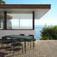 Fritz Hansen Vind Table with Chairs in Hunter Green — lifestyle view
