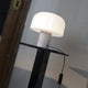 Flos Bellhop Glass T Table Light in White — lifestyle, living room, ph. Mattia Parodi 2