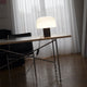 Flos Bellhop Glass T Table Light — lifestyle, living room, ph. Mattia Parodi