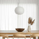 Flos Glo-Ball S2 Pendant Light in White — lifestyle, dining room