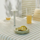HAY Host Portable Table Lamp 220 in Cream White — lifestyle, with Barro Plate and Curve Stem Glass