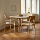 Skagerak Hven Oak Dining Armchair — lifestyle with Hven Round Dining Table