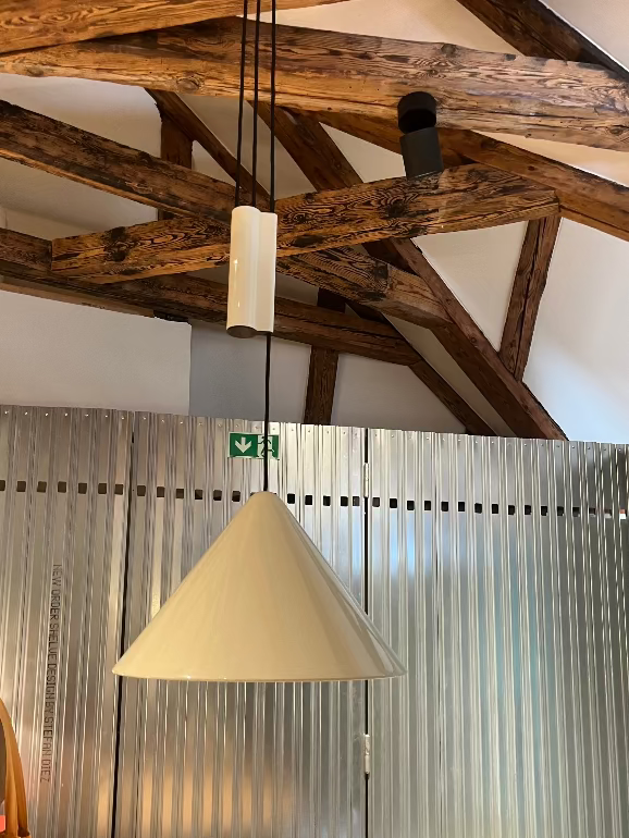 Ceiling with wooden beams and Hay Compass Adjustable Pendant launch at 3DD 2025 Copenhagen