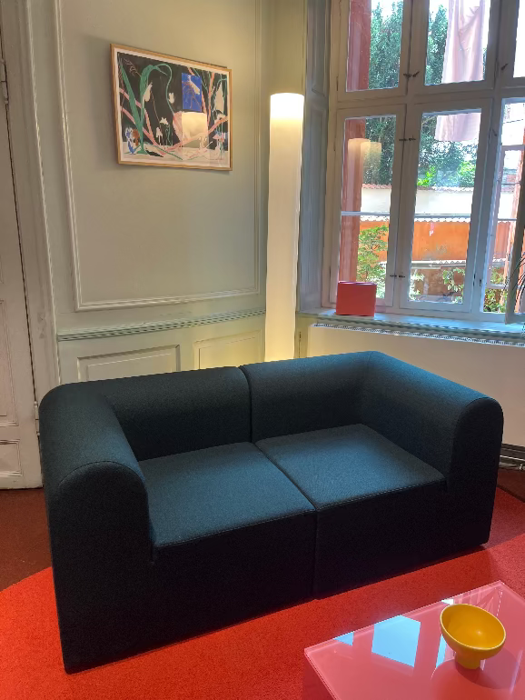 Montana Paradigm Modern black modular sofa in a room with a window and decorative elements.