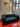 Montana Paradigm Modern black modular sofa in a room with a window and decorative elements.