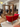 Red sofa with wooden frame in a room with people and mirrors at the Carl Hansen Copenhagen store during 3daysofdesign 2025 festival. Nana ditzel ND52 sofa