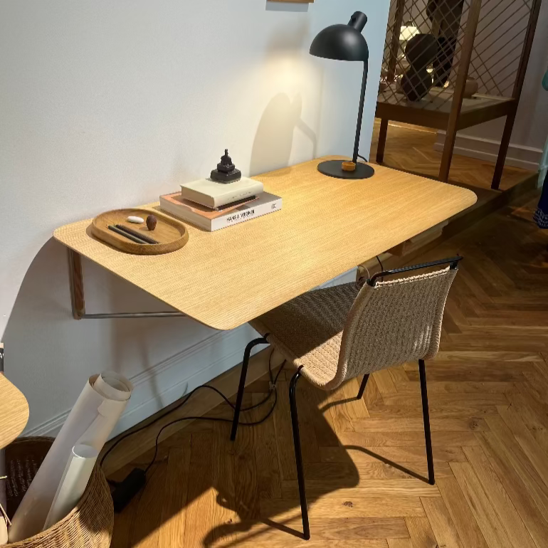 AB019 oak wall hung desk by Anker Bak for Carl Hansen with chair in a room with a lamp and decor items.