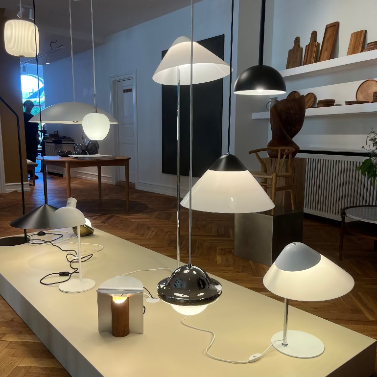 Opala lighting of Display of various pendant and table lamps in a showroom setting, Carl Hansen Copenhagen store