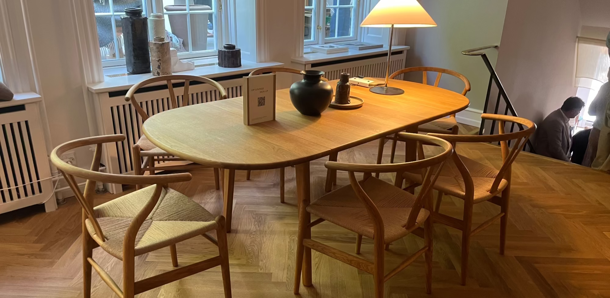 Carl Hansen solid oak Dining table and ch24 chairs on a wooden floor in Copenhagen