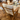 Ch290 Wooden lounge chair with white cushion by hans wegner for carl hansen on a wooden floor in an indoor setting in copenhagen