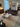 Modern living room with a brown sofa, marble coffee table, and decorative items. Audo House Copenhagen 2023 3DD