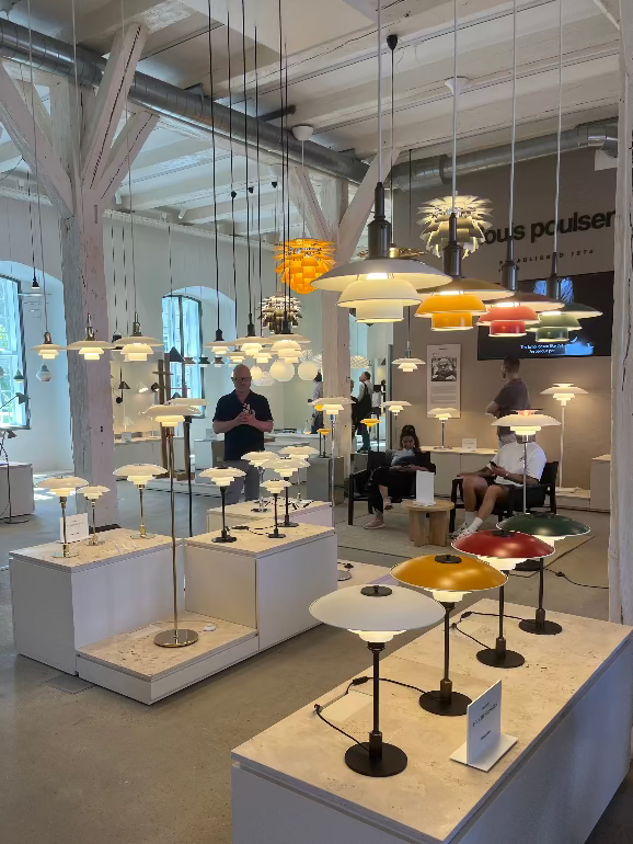 Display of various Louis Poulsen PH pendant lights in a showroom setting at their HQ in Copenhagen