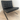 Knoll Barcelona Bauhaus special edtion lounge chair. Black leather chair on a wooden floor with a white wall background