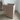 Montana Preppy storage wheeled unit.  Beige trash can on a wooden floor with a white wall in the background