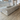 rear of B&B Italia Tufty-Time 20 modular sofa in light greige fabric in showroom Innes