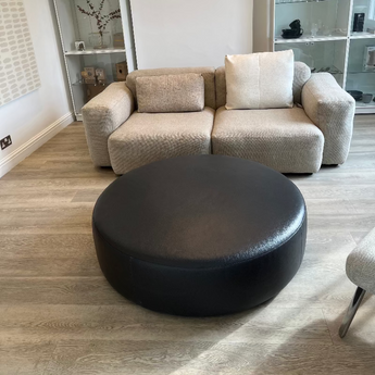 B&B Italia HL110P Large Ottoman in dark grey brown leather and Hay Mags soft sofa in beige fabric  and Montana white shelving in Innes showroom in hessle 2025