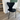 Fritz Hansen 3107 series 7 black leather upholstered dining  chair with black legs on oak floor