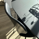 Fritz Hansen 3107 Series 7 Dining chair, front upholstered in black essential leather and black ash frame and black lacquered legs in Innes showroom on oak floor with B611 Superellipse dining table