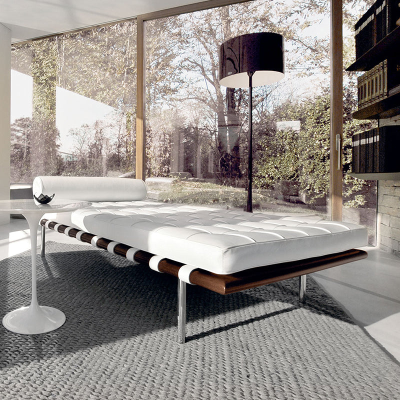 Knoll Barcelona Reax Day bed and saarinen side table in modern living room with large glass windows