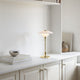 Louis Poulsen PH 2/1 Portable Table Lamp in Brass Metallised — lifestyle, living room