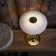 Louis Poulsen PH 2/1 Portable Table Lamp in Brass Metallised — lifestyle, detail