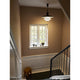 Louis Poulsen PH 5/5 Pendant Light in Black Metal with White Opal Glass — lifestyle, hallway