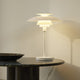 Louis Poulsen PH 80 Table Lamp in Opal White / White — lifestyle, living room, lamp on