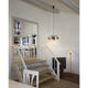 Louis Poulsen PH 1/1 Chandelier Centenary Edition styled with a PH floor lamp in a Scandinavian interior