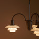 Louis Poulsen PH 1/1 Chandelier Centenary Edition 3-arm close-up detail, illuminated 1