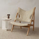 Audo Knitting Lounge Chair Sheepskin — lifestyle, with Androgyne Side Table, Column Table Lamp and Houkime Rug