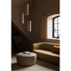 Audo Hashira Pendant Light — lifestyle, with Audo Tearoom Sofa, Audo Cairn Pouf, Audo Losaria Pillow, and Audo Interconnect Candle Holder