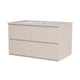 A two-drawer vanity cabinet in a light beige finish with a speckled white countertop and integrated sink, shown against a plain white background.