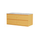 A modern two-drawer vanity cabinet in a soft dusty pink finish, featuring a light gray speckled stone-look top with an integrated sink, shown against a plain white background.