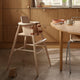 Carl Hansen ND54 High Chair With Baby Backrest in Beech Lacquer — lifestyle, with OW224 Table