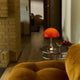 Louis Poulsen Panthella 250 Portable The Originals — Original Opal Red illuminated, lifestyle view 1
