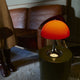 Louis Poulsen Panthella 250 Portable The Originals — Original Opal Red illuminated, lifestyle view 2
