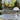 Louis Poulsen Panthella 250 Portable The Originals — Orange, Blue Grey and Brown colourways illuminated in an outdoor setting